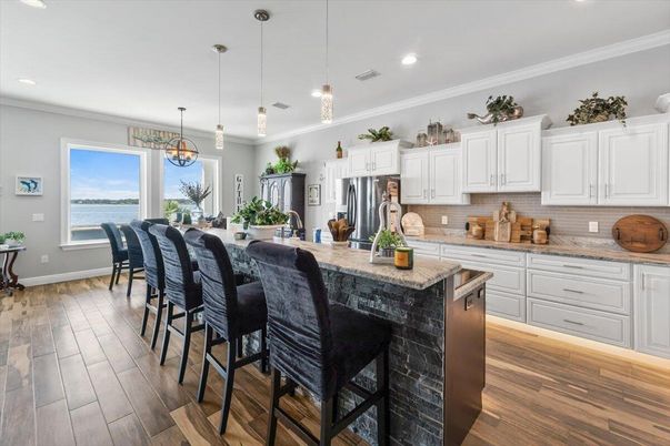Dining room, Interior, Kitchen, Pendant Lights, Recessed Lighting, Stainless Steel Appliances, Water, Wood Texture Flooring