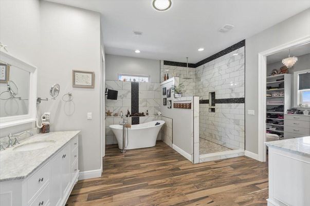 Bathroom, Dual Sink Vanities, Free Standing Baths, Interior, Pendant Lights, Recessed Lighting, Wood Texture Flooring