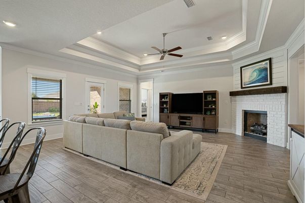 Fireplace, Interior, Living room, Recessed Lighting, Stone Walls, Wood Texture Flooring