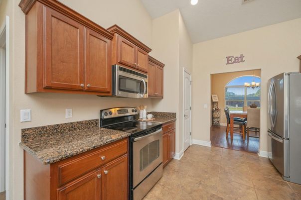 Chandelier, Dining room, Interior, Kitchen, Recessed Lighting, Stainless Steel Appliances, Wood Texture Flooring
