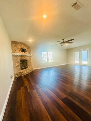 Empty room, Fireplace, Interior, Recessed Lighting, Stone Walls, Wood Texture Flooring
