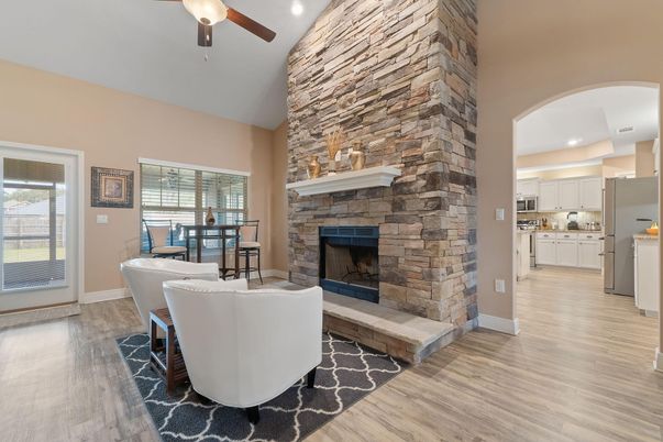 Dining room, Fireplace, Interior, Kitchen, Recessed Lighting, Stone Walls, Wood Texture Flooring