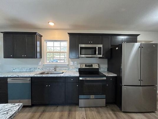 Interior, Kitchen, Recessed Lighting, Stainless Steel Appliances, Wood Texture Flooring