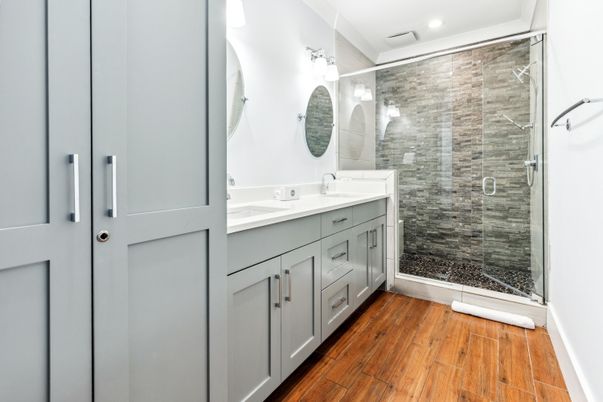 Bathroom, Dual Sink Vanities, Glass Shower, Interior, Recessed Lighting, Wood Texture Flooring