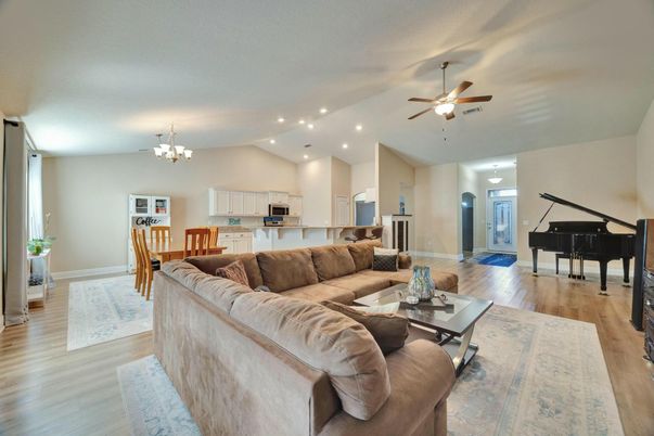 Chandelier, Dining room, Interior, Living room, Piano, Recessed Lighting, Wood Texture Flooring
