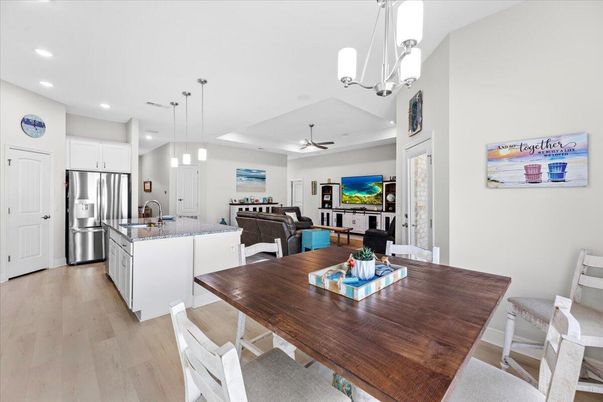 Dining room, Interior, Kitchen, Living room, Pendant Lights, Recessed Lighting, Stainless Steel Appliances, Wood Texture Flooring