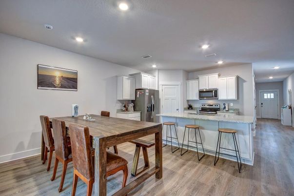 Dining room, Interior, Kitchen, Recessed Lighting, Stainless Steel Appliances, Wood Texture Flooring