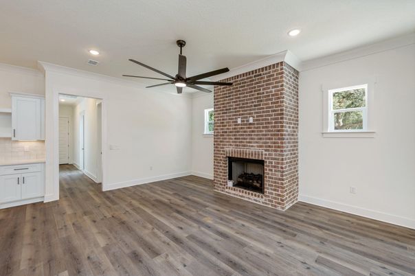 Empty room, Fireplace, Interior, Recessed Lighting, Stone Walls, Wood Texture Flooring