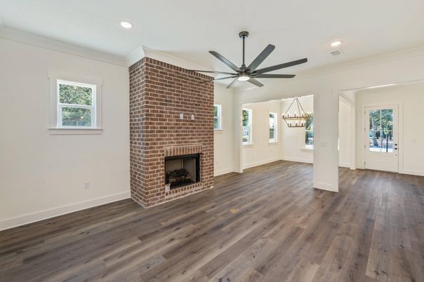 Empty room, Fireplace, Interior, Pendant Lights, Recessed Lighting, Stone Walls, Wood Texture Flooring