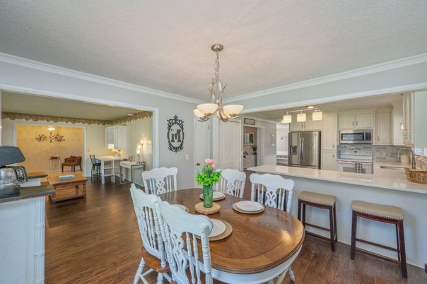 Chandelier, Dining room, Interior, Kitchen, Pendant Lights, Stainless Steel Appliances, Wood Texture Flooring