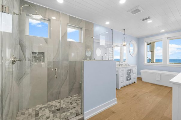 Bathroom, Free Standing Baths, Glass Shower, Interior, Pendant Lights, Recessed Lighting, Water, Wood Texture Flooring