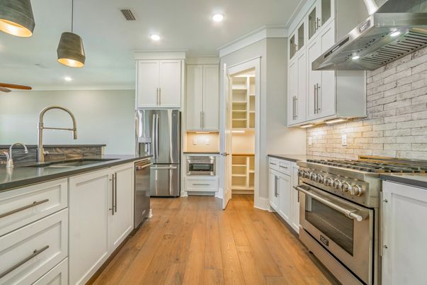 Interior, Kitchen, Pendant Lights, Recessed Lighting, Stainless Steel Appliances, Stone Walls, Wood Texture Flooring