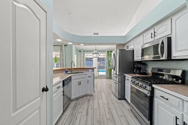Interior, Kitchen, Pendant Lights, Recessed Lighting, Stainless Steel Appliances, Wood Texture Flooring