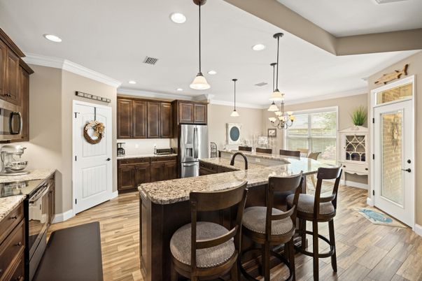Dining room, Interior, Kitchen, Pendant Lights, Recessed Lighting, Stainless Steel Appliances, Wood Texture Flooring