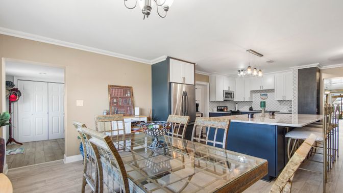 Chandelier, Dining room, Interior, Kitchen, Stainless Steel Appliances, Wood Texture Flooring