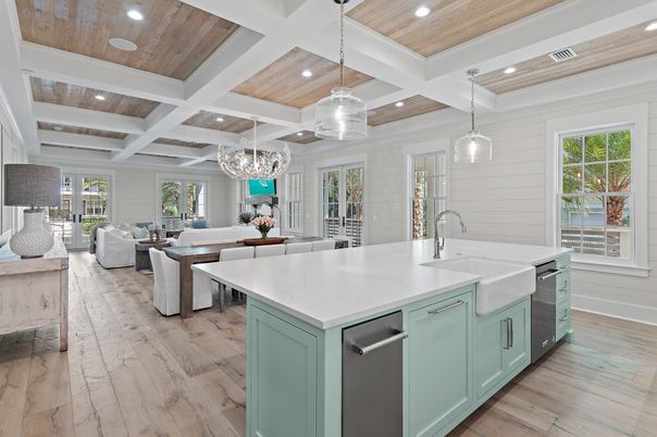 Chandelier, Dining room, Interior, Kitchen, Living room, Pendant Lights, Recessed Lighting, Stainless Steel Appliances, Wooden Ceilings, Wood Texture Flooring