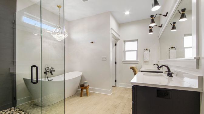 Bathroom, Chandelier, Free Standing Baths, Glass Shower, Interior, Pendant Lights, Recessed Lighting, Wood Texture Flooring