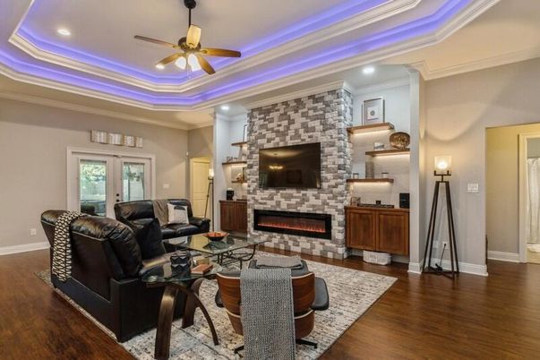 Fireplace, Interior, Living room, Recessed Lighting, Stone Walls, Wood Texture Flooring