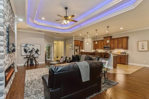 Fireplace, Interior, Kitchen, Living room, Pendant Lights, Recessed Lighting, Stainless Steel Appliances, Stone Walls, Wood Texture Flooring