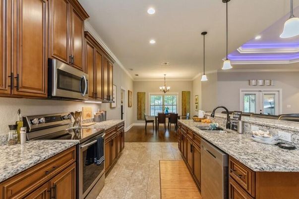 Chandelier, Dining room, Interior, Kitchen, Pendant Lights, Recessed Lighting, Stainless Steel Appliances, Wood Texture Flooring