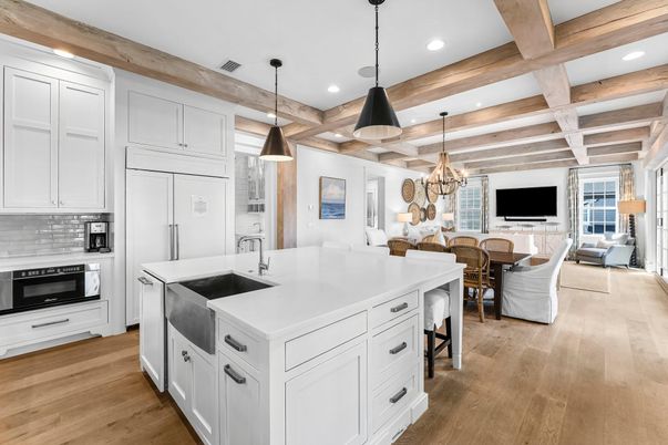 Chandelier, Dining room, Interior, Kitchen, Living room, Pendant Lights, Recessed Lighting, Stainless Steel Appliances, Wooden Beams, Wood Texture Flooring