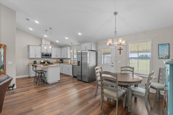 Dining room, Interior, Kitchen, Pendant Lights, Recessed Lighting, Stainless Steel Appliances, Wood Texture Flooring