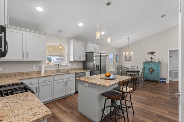 Chandelier, Dining room, Interior, Kitchen, Pendant Lights, Recessed Lighting, Stainless Steel Appliances, Wood Texture Flooring