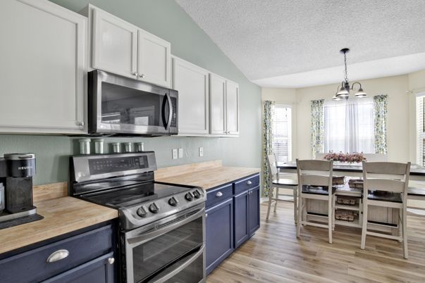 Dining room, Interior, Kitchen, Pendant Lights, Stainless Steel Appliances, Wood Texture Flooring