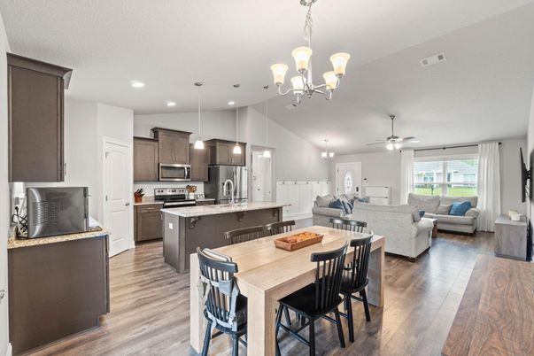 Chandelier, Dining room, Interior, Kitchen, Living room, Pendant Lights, Recessed Lighting, Stainless Steel Appliances, Wood Texture Flooring