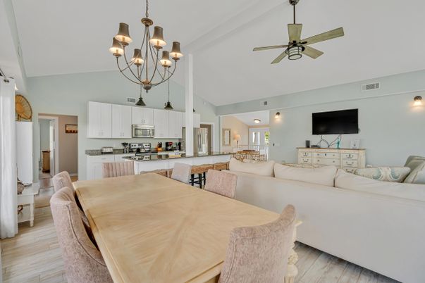 Chandelier, Dining room, Interior, Kitchen, Living room, Stainless Steel Appliances, Wood Texture Flooring