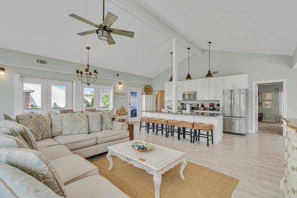 Chandelier, Dining room, Interior, Kitchen, Living room, Pendant Lights, Stainless Steel Appliances, Wood Texture Flooring