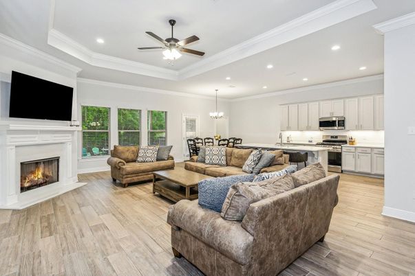 Chandelier, Dining room, Fireplace, Interior, Kitchen, Living room, Pendant Lights, Recessed Lighting, Stainless Steel Appliances, Wood Texture Flooring