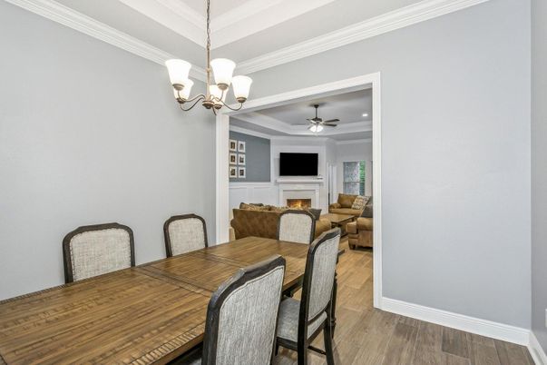 Chandelier, Dining room, Fireplace, Interior, Living room, Recessed Lighting, Wood Texture Flooring