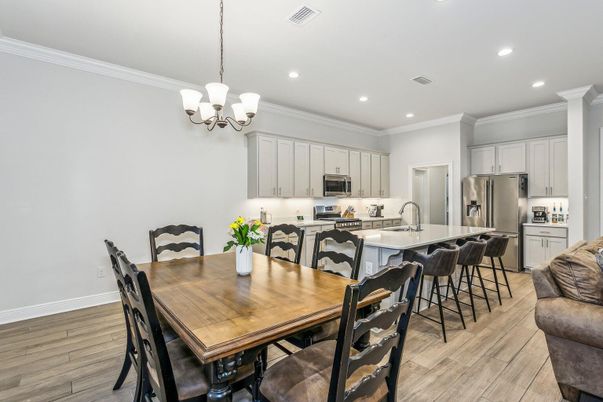 Chandelier, Dining room, Interior, Kitchen, Recessed Lighting, Stainless Steel Appliances, Wood Texture Flooring