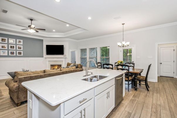 Chandelier, Dining room, Fireplace, Interior, Kitchen, Living room, Recessed Lighting, Wood Texture Flooring