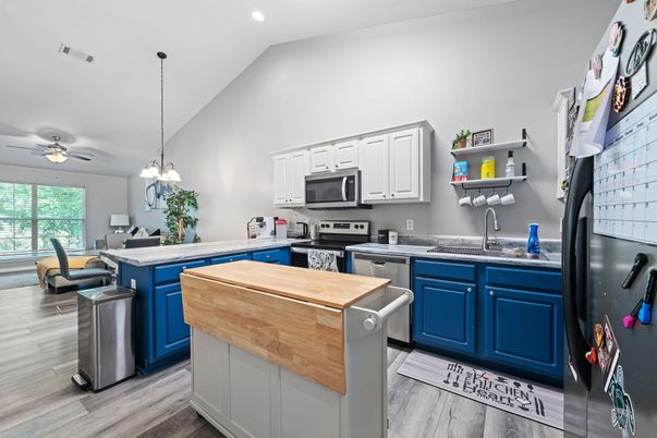 Dining room, Interior, Kitchen, Pendant Lights, Recessed Lighting, Stainless Steel Appliances, Wood Texture Flooring