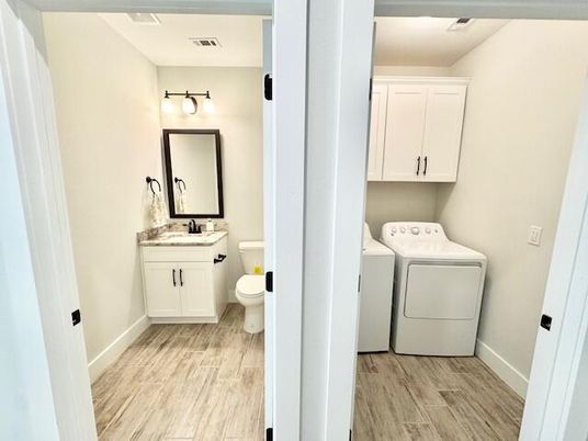 Bathroom, Interior, Utility Closets, Washer, Wood Texture Flooring