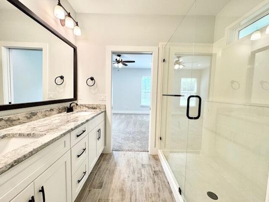 Bathroom, Dual Sink Vanities, Glass Shower, Interior, Wood Texture Flooring