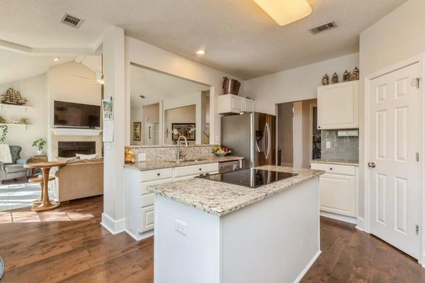Fireplace, Interior, Kitchen, Living room, Recessed Lighting, Stainless Steel Appliances, Wood Texture Flooring