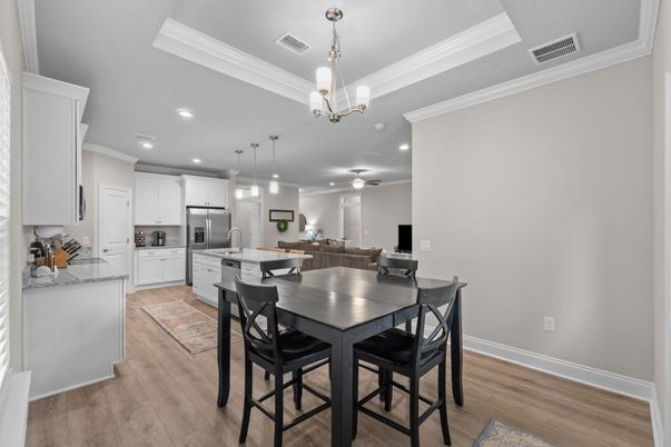 Chandelier, Dining room, Interior, Kitchen, Pendant Lights, Recessed Lighting, Stainless Steel Appliances, Wood Texture Flooring