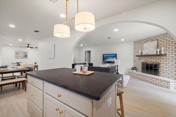 Dining room, Fireplace, Interior, Living room, Pendant Lights, Recessed Lighting, Stone Walls, Wood Texture Flooring