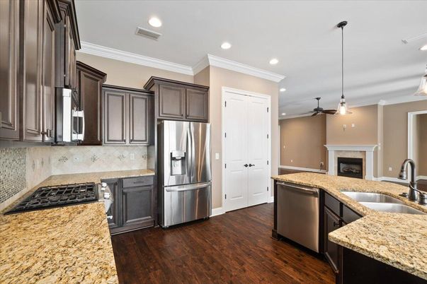Fireplace, Interior, Kitchen, Pendant Lights, Recessed Lighting, Stainless Steel Appliances, Wood Texture Flooring