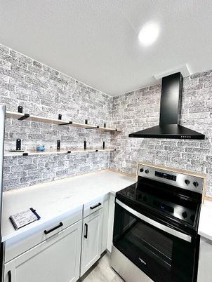Interior, Kitchen, Recessed Lighting, Stainless Steel Appliances, Stone Walls