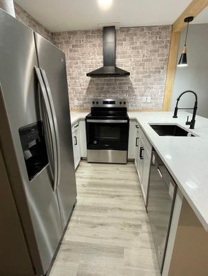 Interior, Kitchen, Pendant Lights, Recessed Lighting, Stainless Steel Appliances, Stone Walls, Wood Texture Flooring