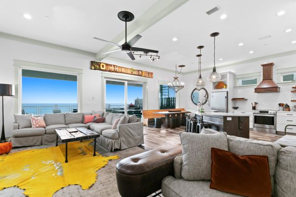 Dining room, Interior, Kitchen, Living room, Pendant Lights, Recessed Lighting, Stainless Steel Appliances, Water, Wood Texture Flooring