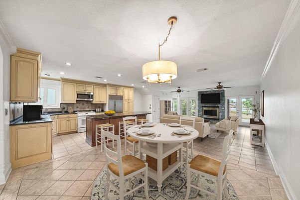 Chandelier, Dining room, Fireplace, Interior, Kitchen, Living room, Recessed Lighting, Stainless Steel Appliances