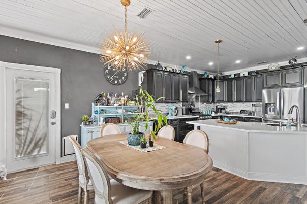 Dining room, Interior, Kitchen, Pendant Lights, Recessed Lighting, Stainless Steel Appliances, Wood Texture Flooring