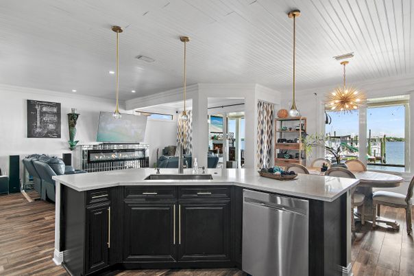 Dining room, Fireplace, Interior, Kitchen, Pendant Lights, Recessed Lighting, Water, Wood Texture Flooring