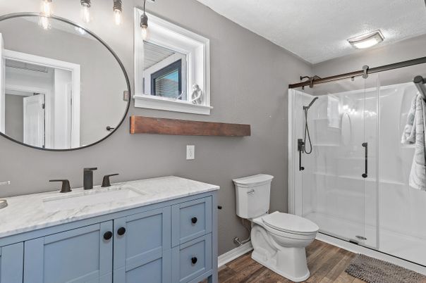 Bathroom, Dual Sink Vanities, Glass Shower, Interior, Wood Texture Flooring