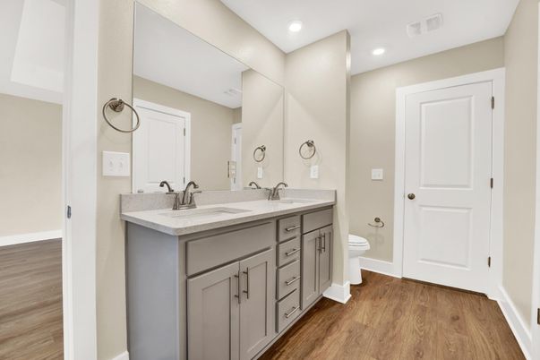 Bathroom, Dual Sink Vanities, Interior, Recessed Lighting, Wood Texture Flooring
